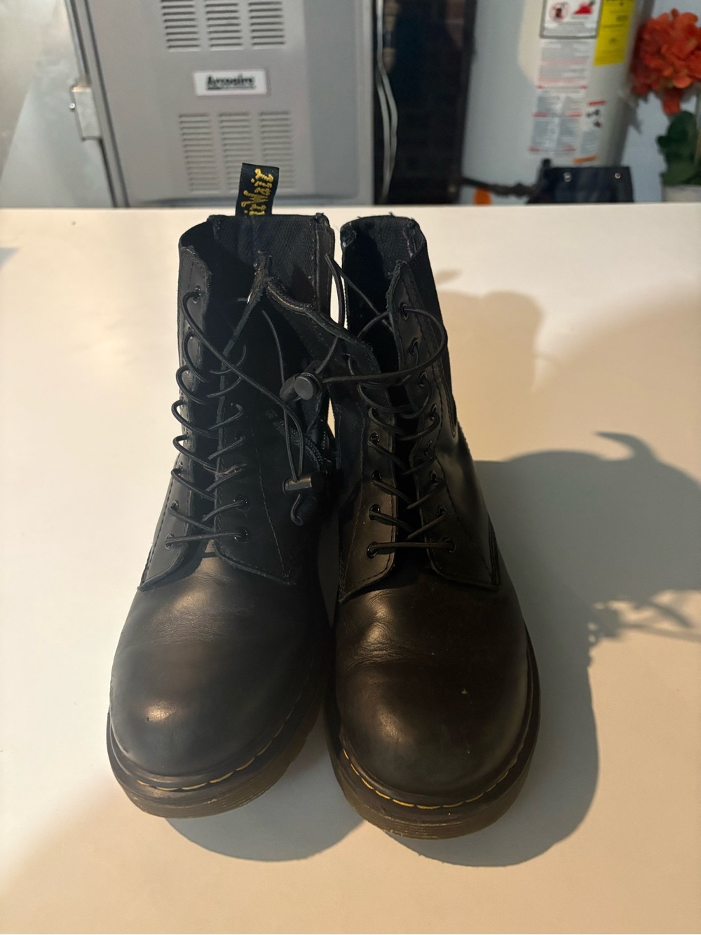 Dr. Martens Black Leather 8-Eye Lace-Up Boots with Yellow Welt Stitching